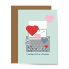 pastel blue greeting card with gray typewriter graphic with red, pink and blue hearts, qr code and type below that reads i can't spell luv without u to show visual pun and design