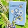 thinking of you card with floral cover art in garden