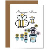 I Love You Mom card with big and little smiling bees with hearts overhead, flowers and one flower pot with qr code that sings to show artwork
