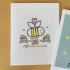 greeting card with smiling bee flying over books, qr code that plays Quiet Bee song