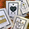 group of four introvert encouragement cards with introvert cat card at center