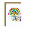 GC098 Wild Child Card Smiling character wearing rainbow colored hat and blue overalls near drum standing under rainbow with Wild Child typography in it