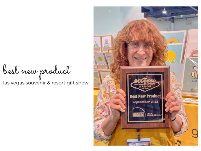 smille songs designer songwriter sharon glassman holding best new product award at las vegas souvenir and resort show