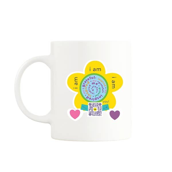 hite mug with a yellow flower design and text that says 'I am grateful, inspired, me,' with a QR code below that plays a song when scanned