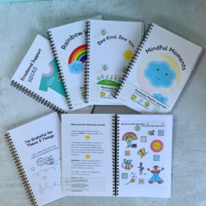 four positively playful journals covers and inside spread to show design and reusable stickers