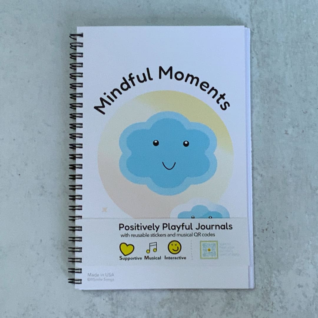 cover of journal with smiling clouds, bellyband with QR code that sings about what journal is and does