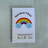 cover of rainbow vibes journal with rainbow and clouds